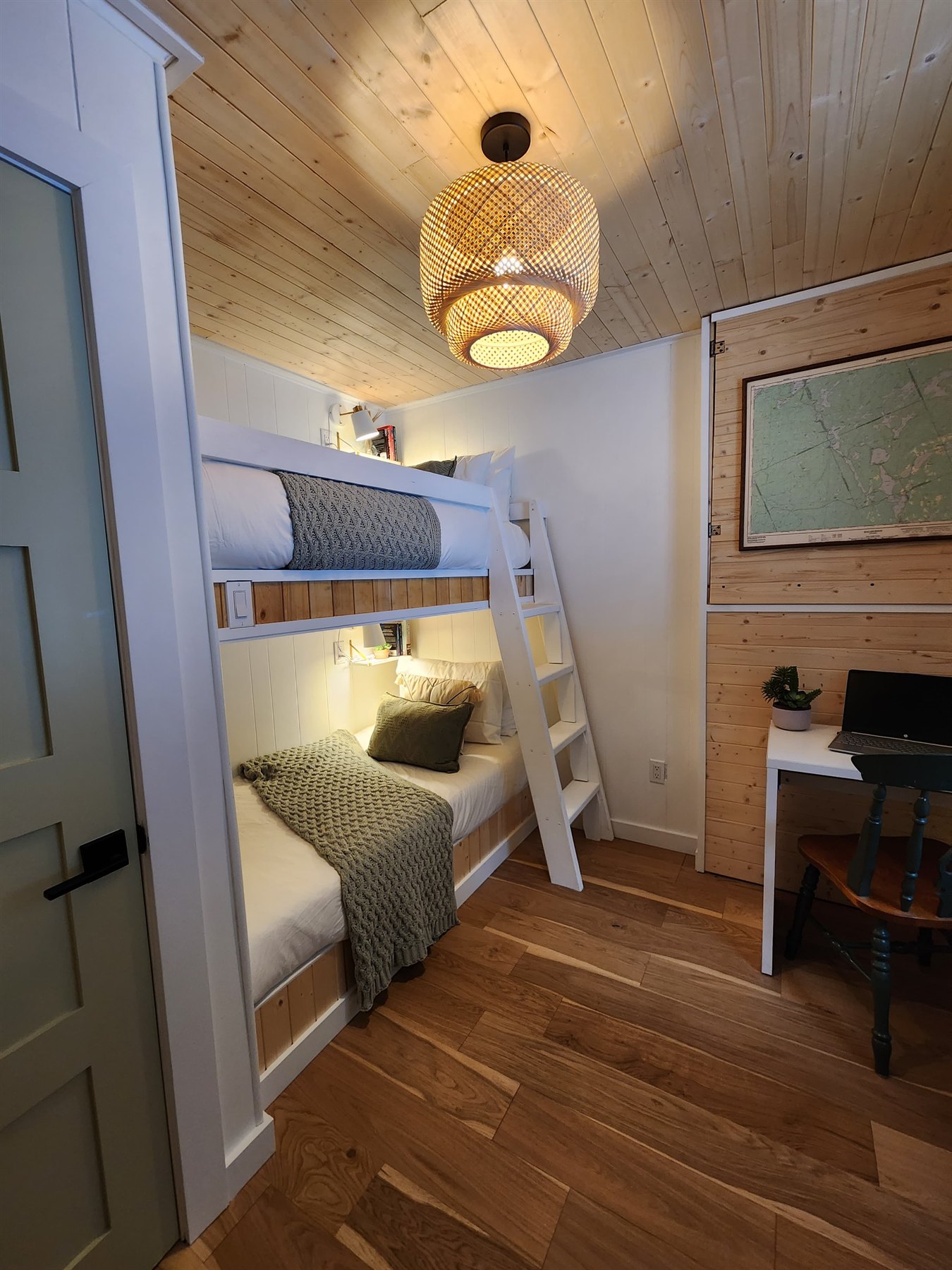 Bunk room with built-in beds and a desk